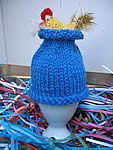egg cosy yellow on mid blue
